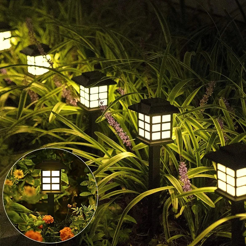 Beeld van  solarlampen in een tuin - kampeerprullenbak.nl